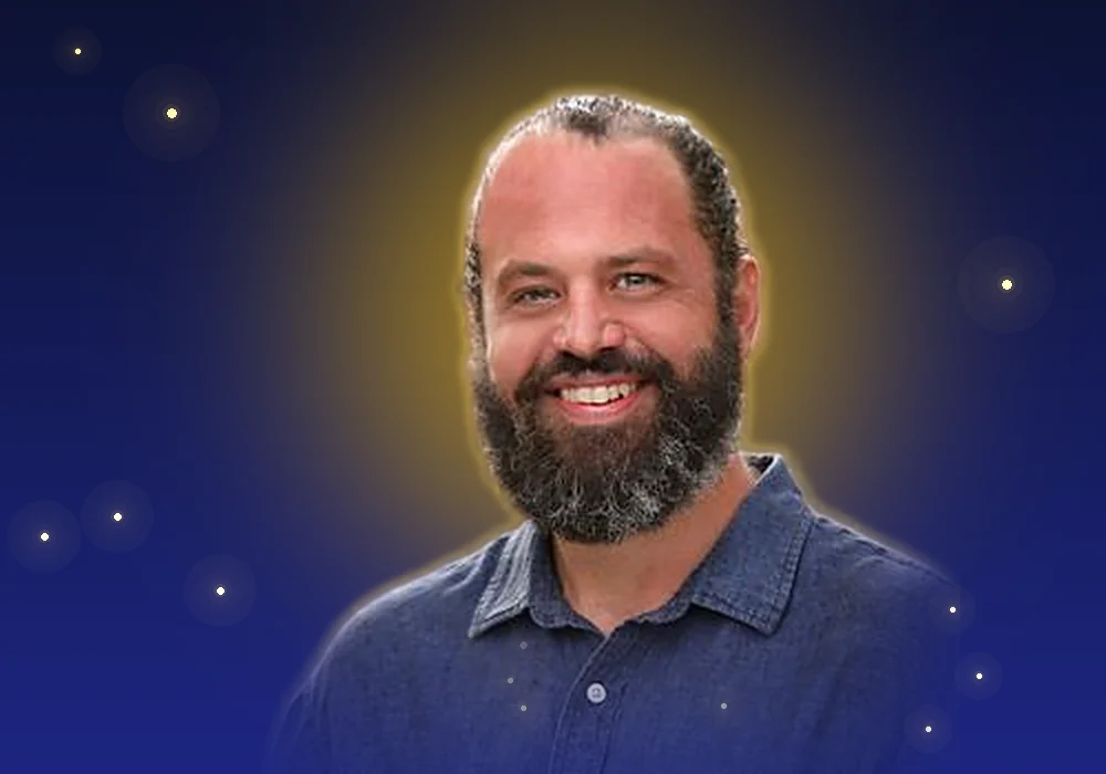 Mike Belyea, smiling, in a blue shirt